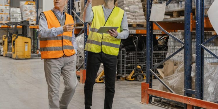 Man with tablet working logistic